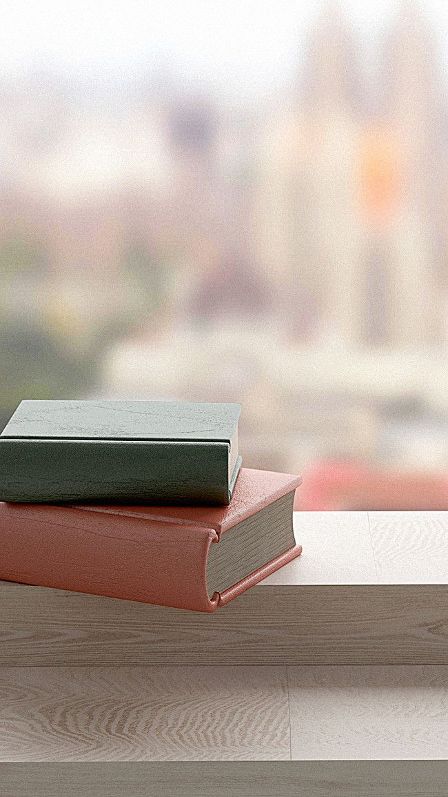 two books sitting on top of each other near a window sill with a city in the background