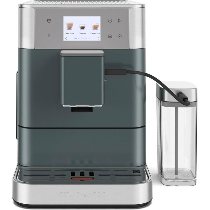 an espresso machine with a glass next to it on a white background,