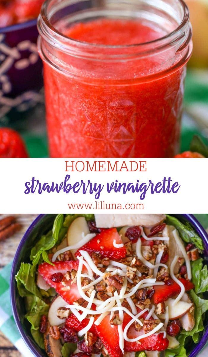 a salad with strawberries, cheese and dressing in a mason jar next to it