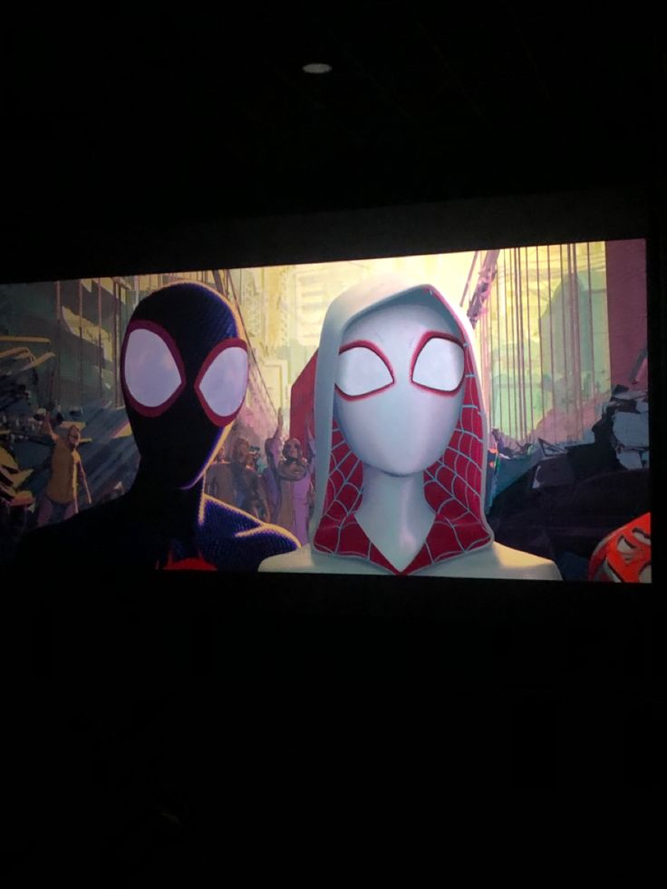 two animated characters are standing in front of a tv screen with the caption spider - man into the spider verse