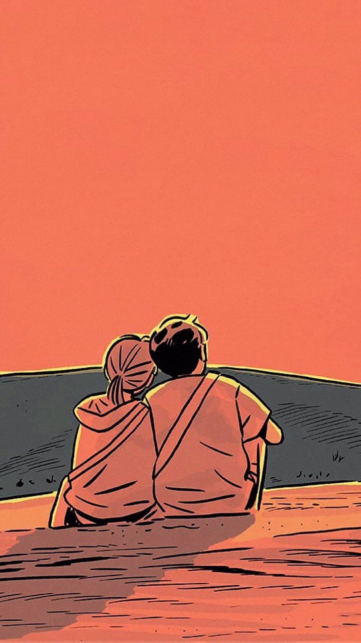 two people sitting on the ground looking at an orange sky