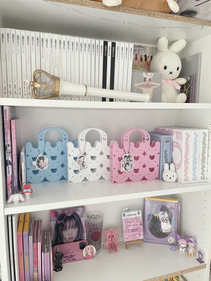 a book shelf filled with lots of books and stuffed animals on top of it's shelves