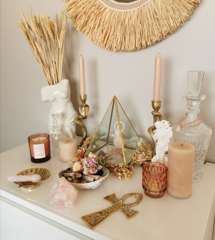 a white table topped with candles and other items