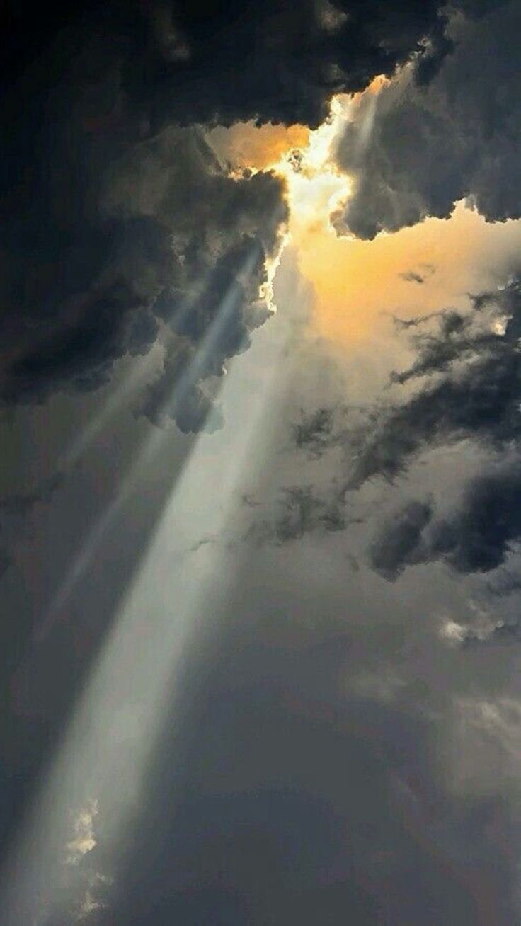 an image of the sun shining through clouds