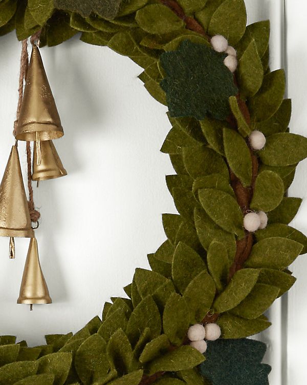 a wreath with bells hanging from it