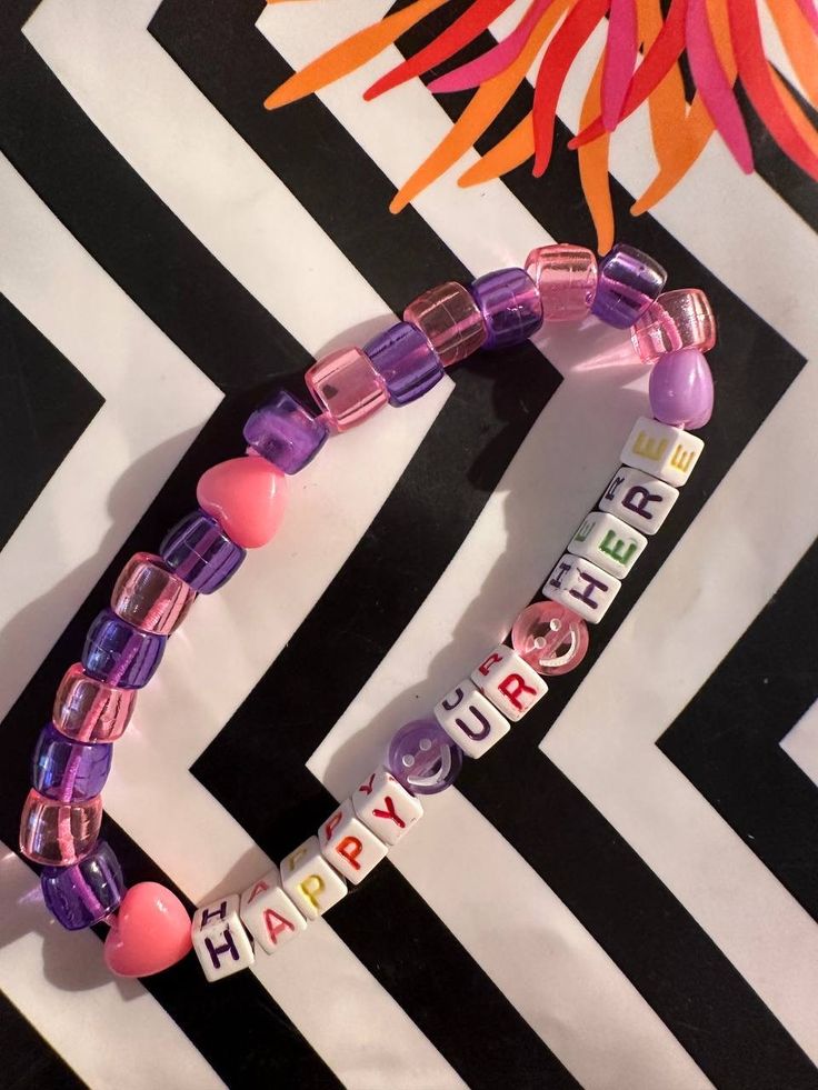 Welcome to my "Kandi Shop" ! Dive into the vibrant world of rave culture with our unique collection of Kandi and trinkets! We offer an array of handcrafted Kandi bracelets, necklaces, and trinkets perfect for any raver or festival-goer. Whether you're looking for a single piece to complete your outfit or a curated package to share with friends, we've got you covered. Our Products Include: Kandi Singles: Unique, colorful beads strung together to create beautiful, one-of-a-kind bracelets. Kandi Pa Customized Pink Jewelry For Friendship, Personalized Pink Jewelry For Festivals, Pink Letter Beads Jewelry For Festival, Pink Letter Beads Festival Jewelry, Pink Jewelry With Letter Beads For Festival, Spiritual Pink Jewelry For Birthday, Fun Festival Bracelet Jewelry, Trendy Letter Beads Jewelry For Festival, Fun Rainbow Jewelry For Festivals