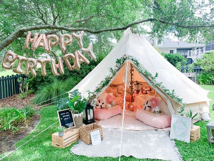 a birthday party with a teepee tent and decorations