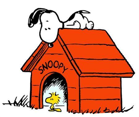 a snoopy doghouse with a person sitting on top