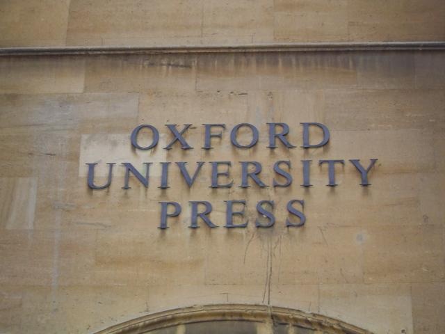 the oxford university press sign is on the side of a building