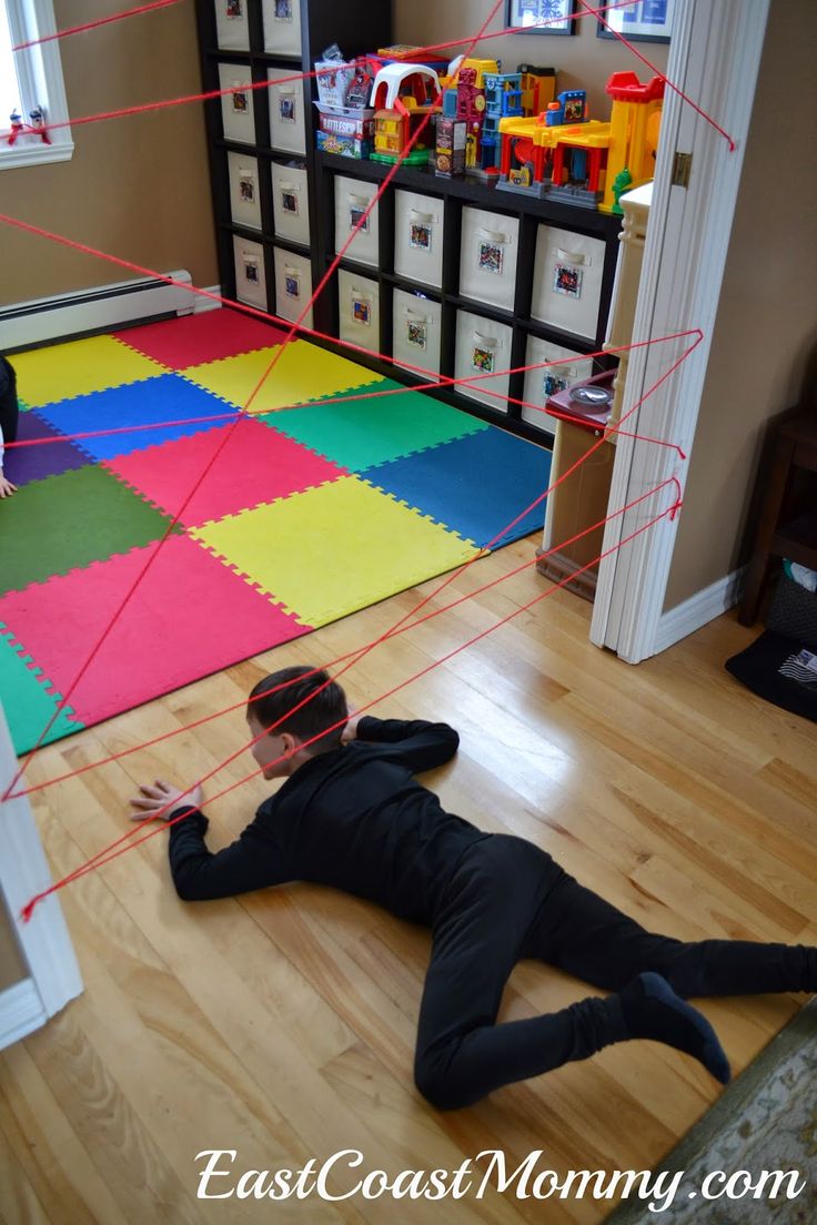 a man laying on the floor in front of a child's room