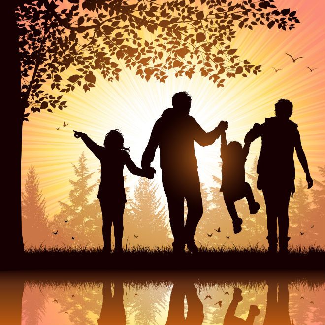 a family walking in the park at sunset with trees and water reflecting on the ground