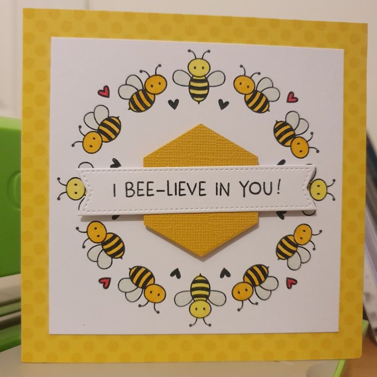 a close up of a card with bees