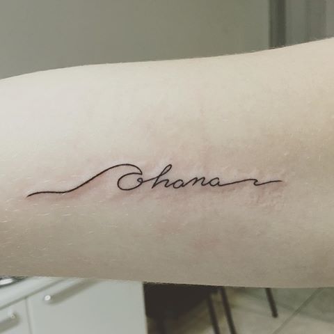 a woman's arm with the word shana written in cursive font