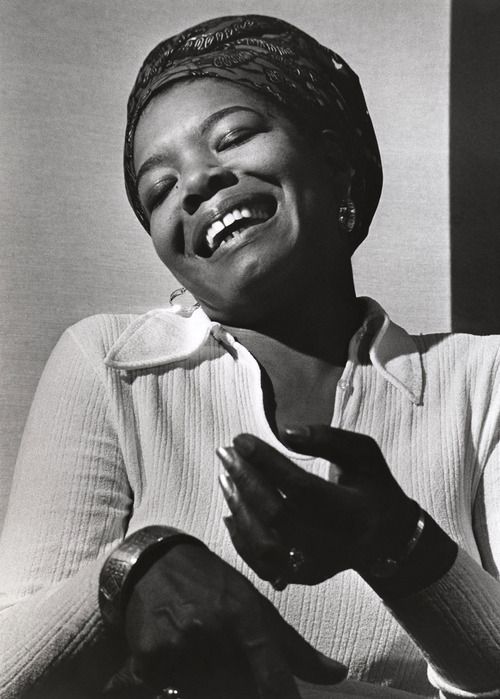 a black and white photo of a woman laughing