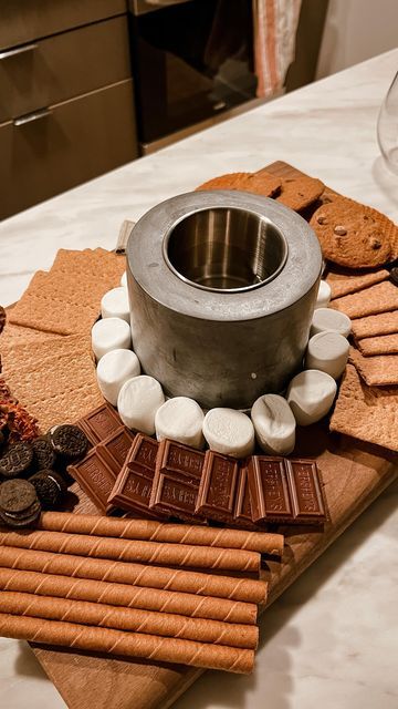 an assortment of cookies, crackers and chocolates on a table