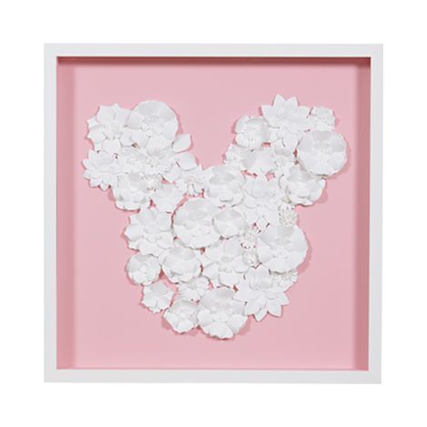 a pink frame with white flowers in the shape of mickey mouse's head on it