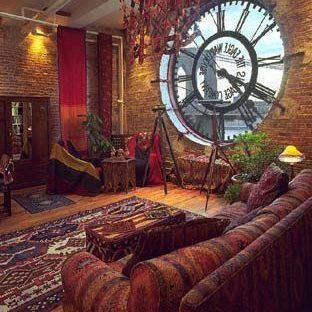 a living room filled with furniture and a large clock on the wall