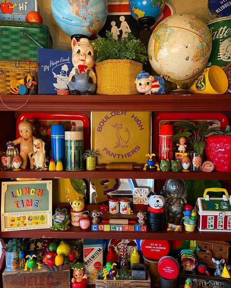 a shelf filled with lots of toys and books