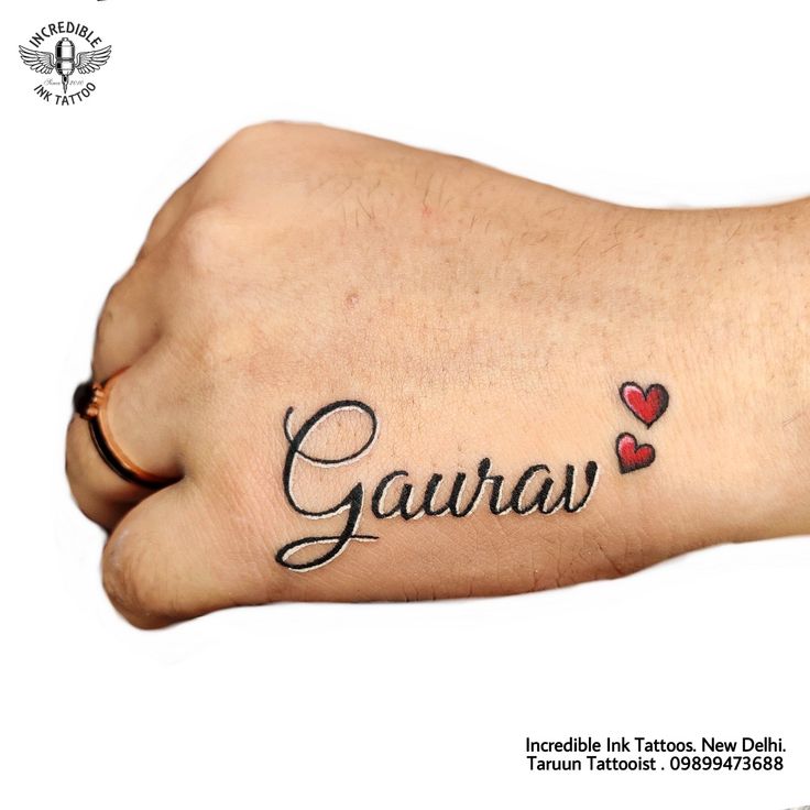 a person's foot with the word gaura written in cursive writing