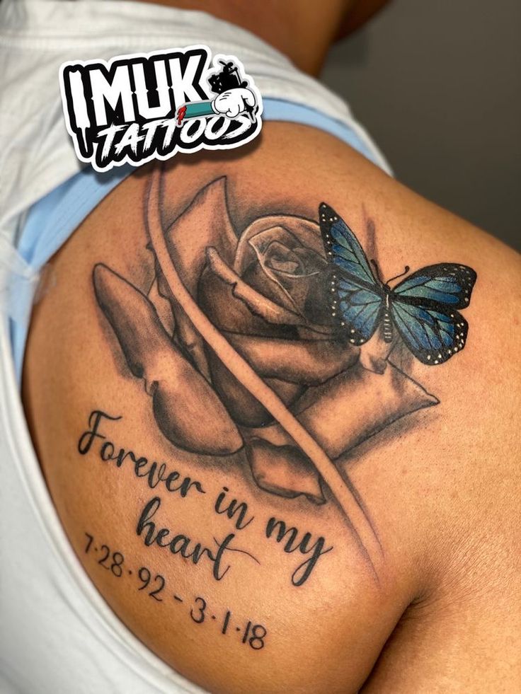 a woman with a tattoo on her shoulder that says forever in my heart and a butterfly