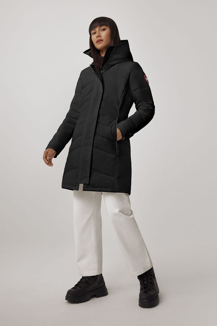 One of our most-loved styles, the Lorette Parka, gets an update with streamlined hood details, elevated trims, and additional inside pockets. Conquer fluctuating temperatures in this sophisticated parka with elaborate quilt-through detailing. Customize your parka and extend the coverage of your hood with a variety of our interchangeable Hood Trim accessories. Men Parka, Heavy Jacket, Baby Outerwear, Mens Parka, Womens Parka, Snow Pants, Waist Pack, Boots And Sneakers, Range Of Motion