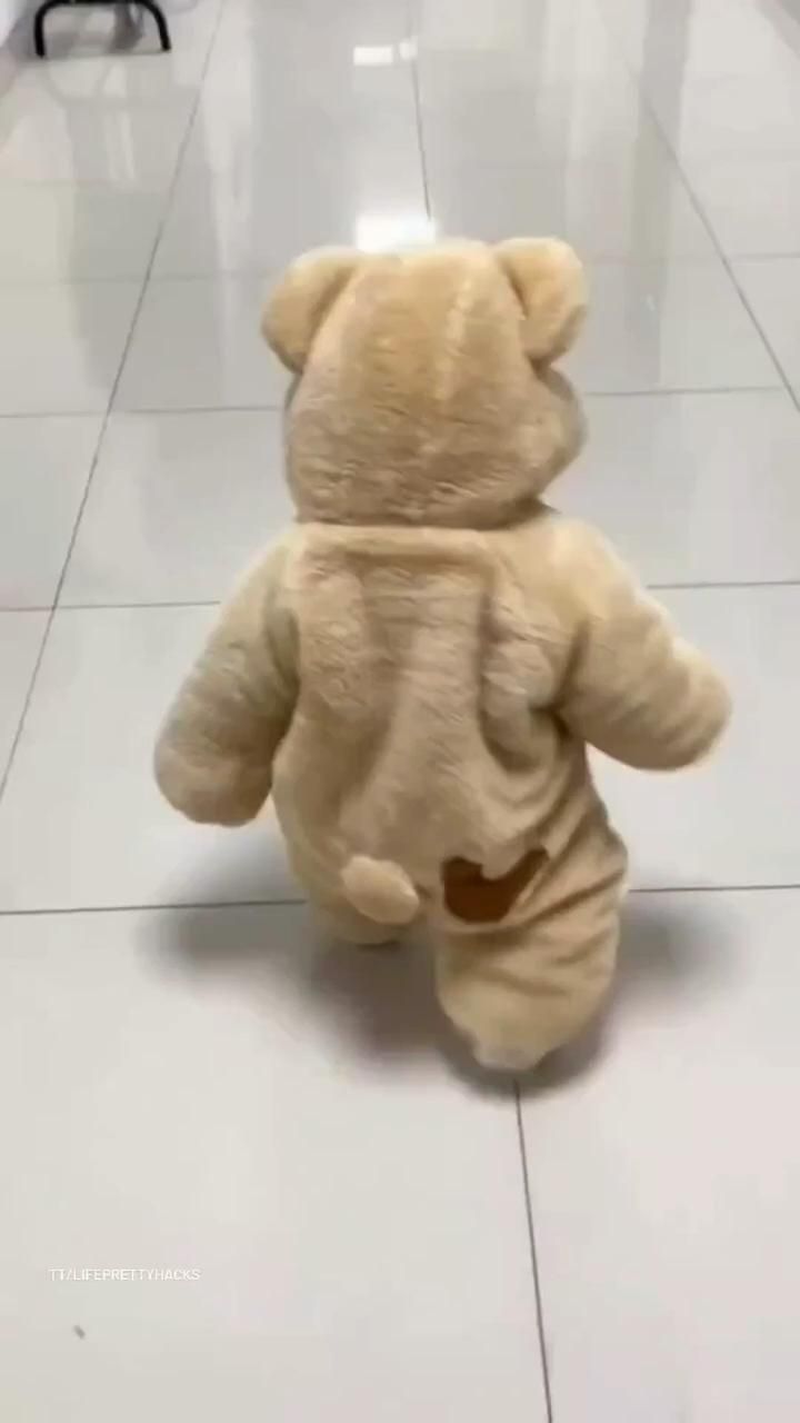 a teddy bear that is sitting on the floor