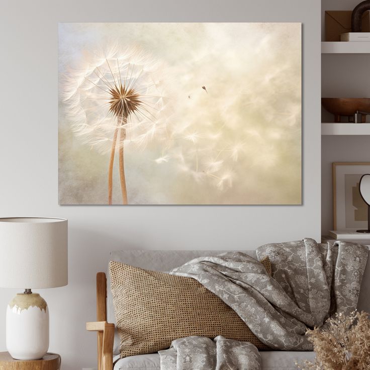 a living room scene with focus on the dandelion canvas wall art above the couch