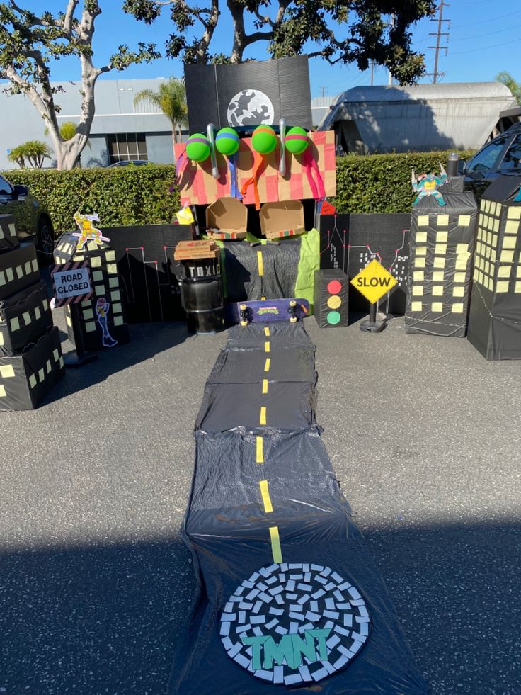 an inflatable trampoline is set up on the ground with decorations around it