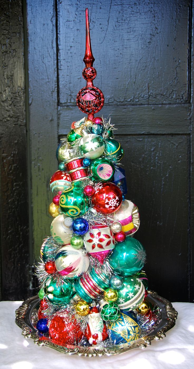 a christmas tree made out of glass ornaments