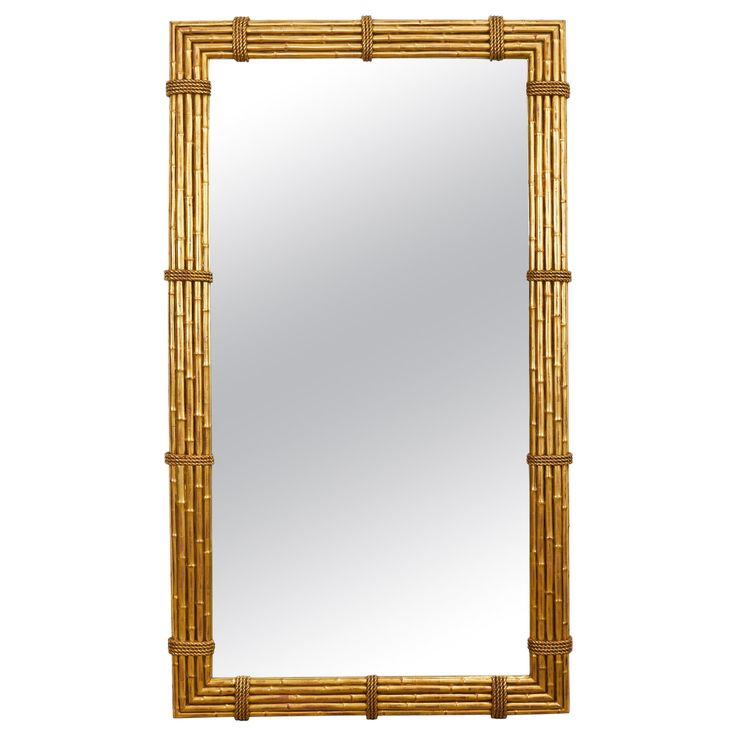 a mirror that is made out of bamboo