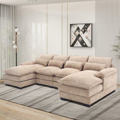 a living room with a large sectional couch