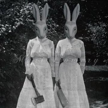 two women in bunny ears are standing next to each other