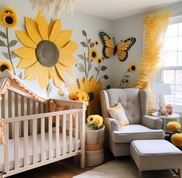 a baby's room with sunflowers on the wall and a crib