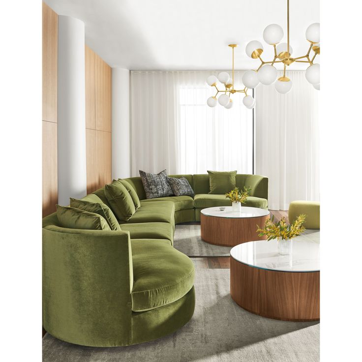 a living room filled with lots of green furniture