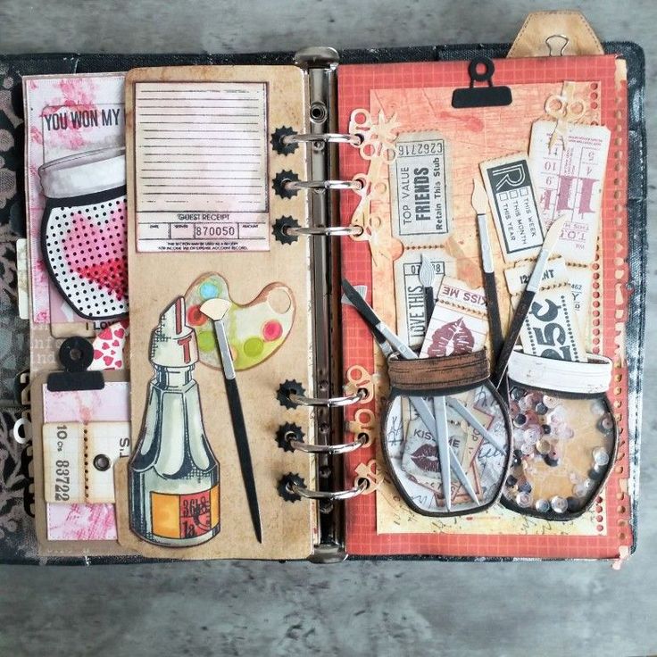 an open book with lots of different things on it, including scissors and other items