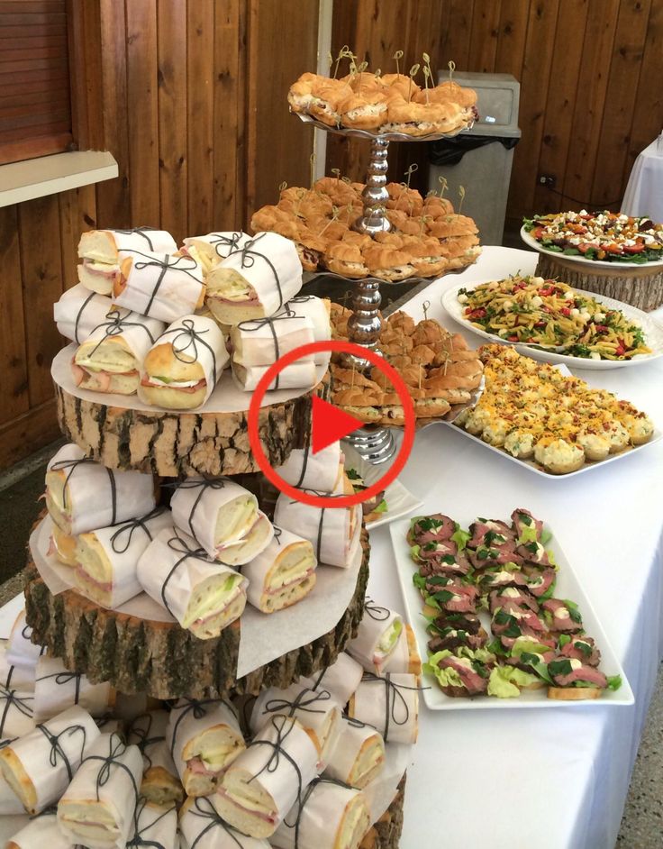 a table topped with lots of different types of desserts and pastries on top of it