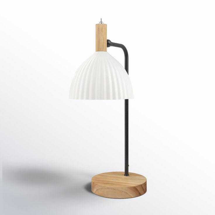 a lamp that is sitting on top of a wooden stand with a white light in the middle