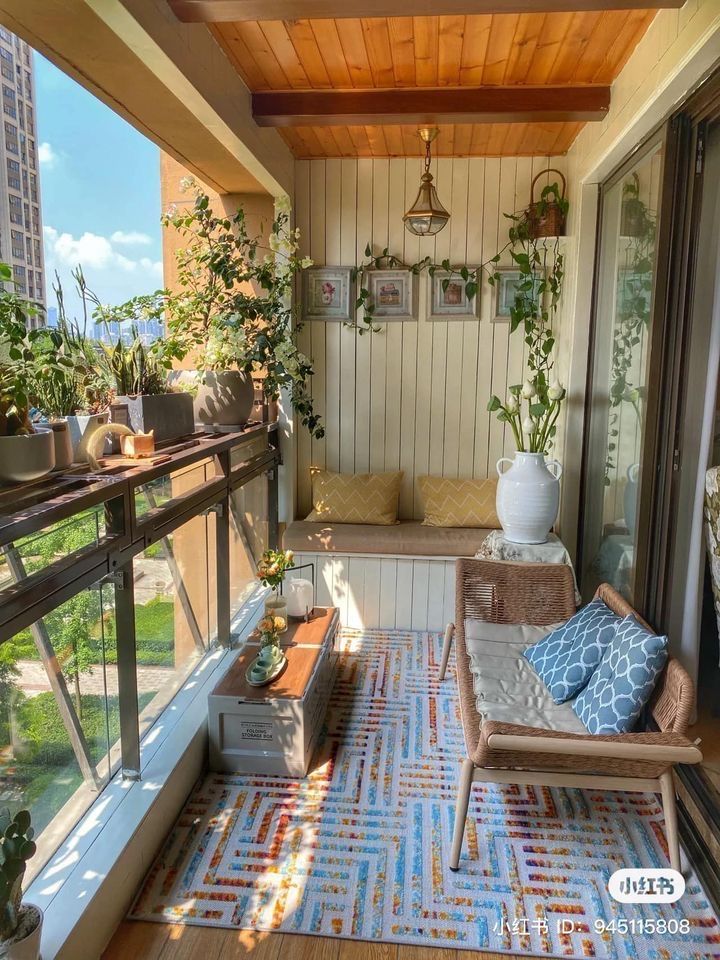 the balcony is decorated with plants and potted plants