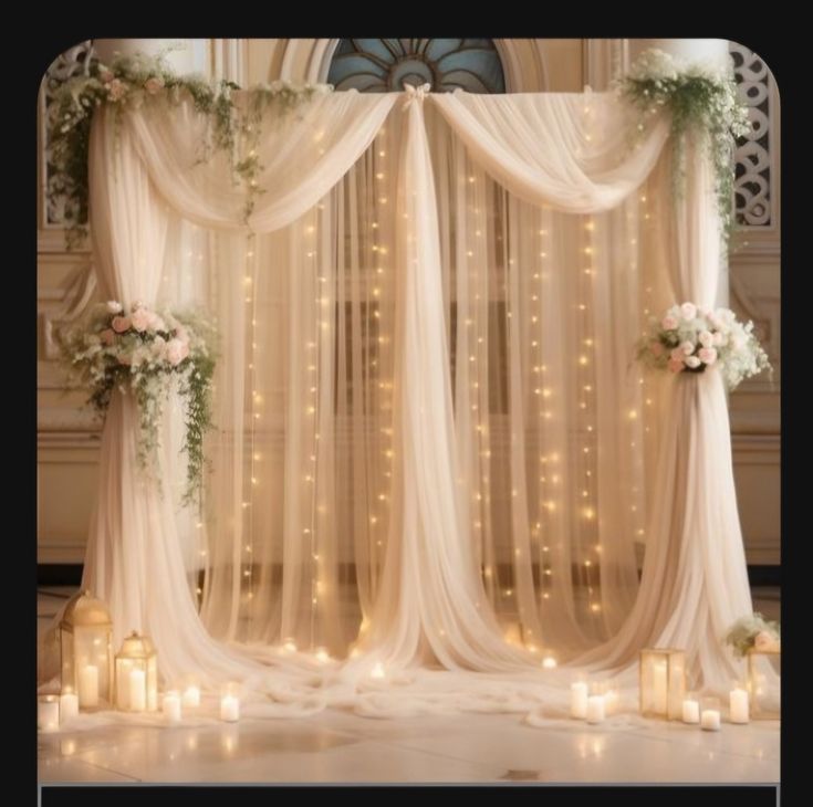 an image of a wedding stage set up with candles and flowers on the side wall