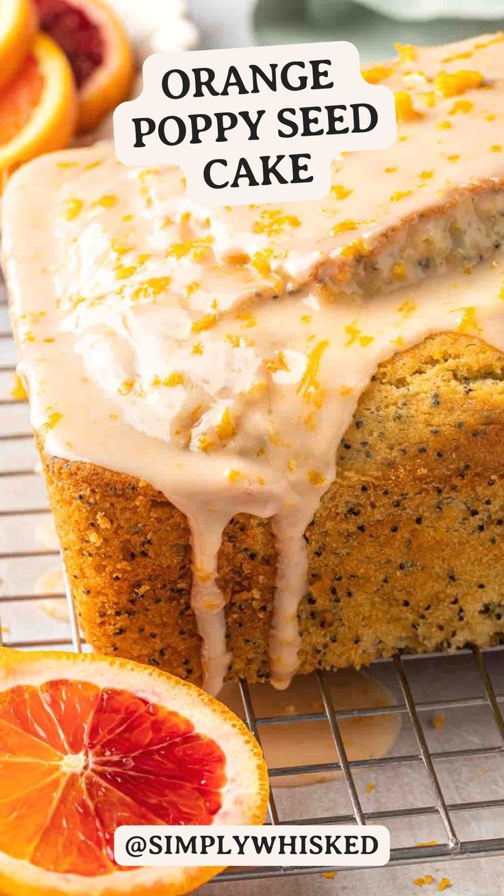 an orange poppy seed cake on a cooling rack with blood oranges in the background