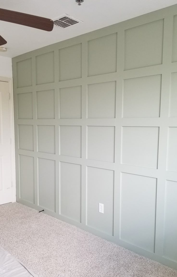 empty room with white walls and ceiling fan