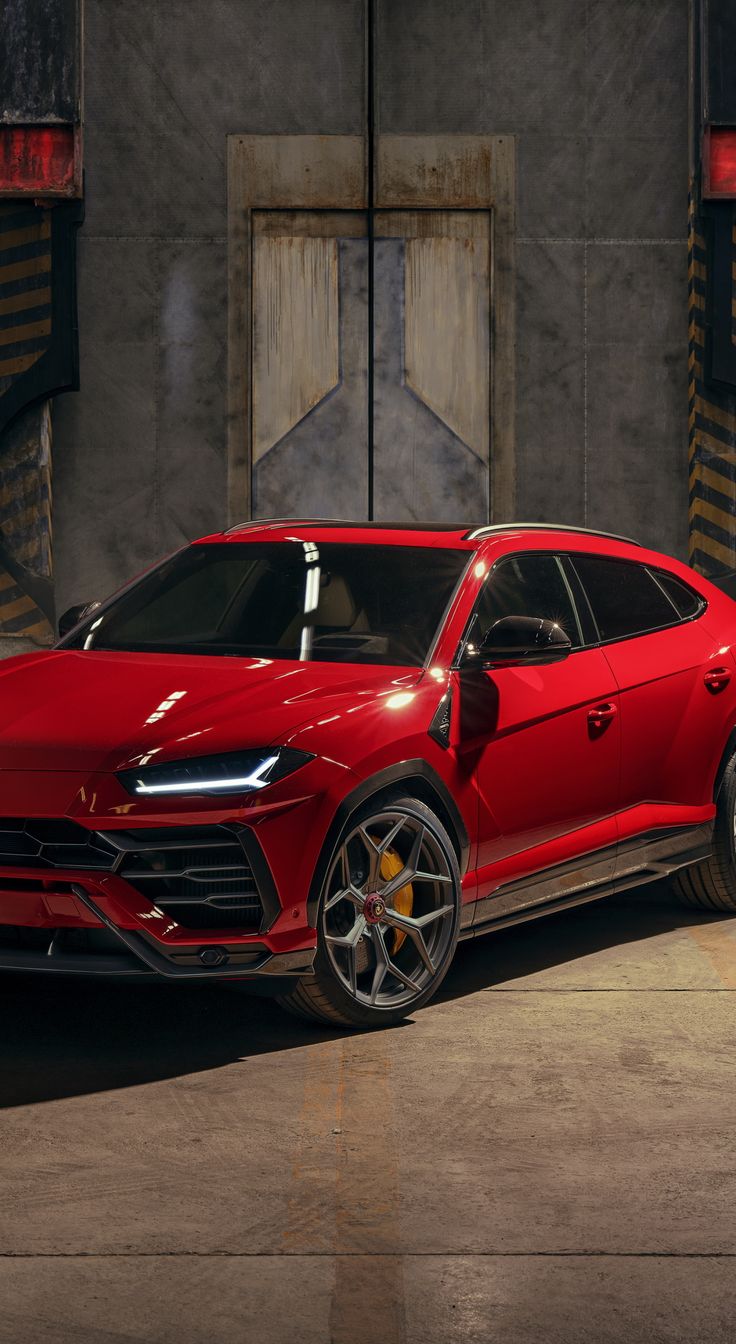 a red sports car parked in front of a building