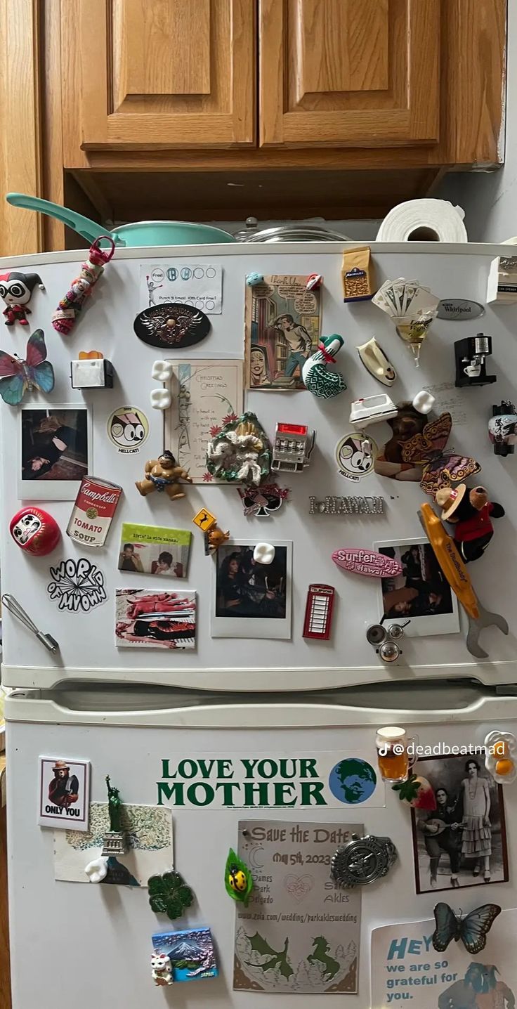 a refrigerator covered in magnets and pictures