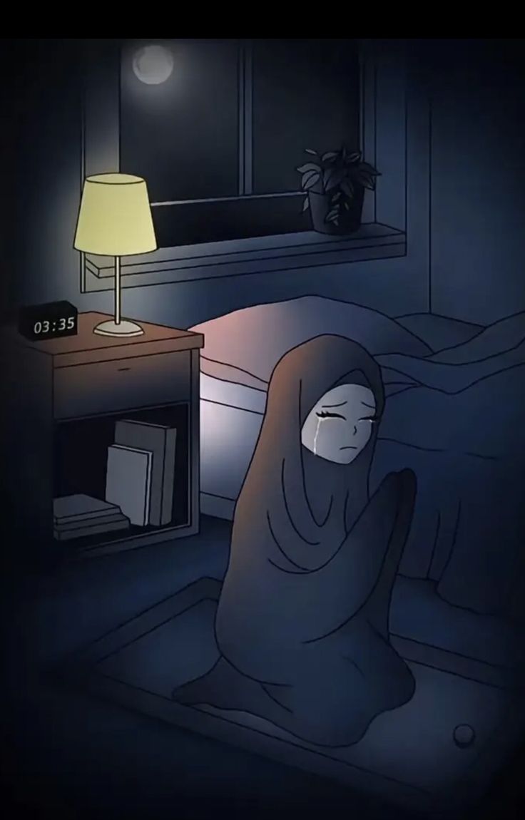 a person sitting on a bed in the dark with a blanket covering their face and head