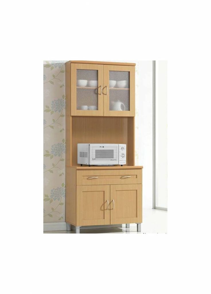 a microwave oven sitting on top of a wooden shelf next to a cabinet with glass doors