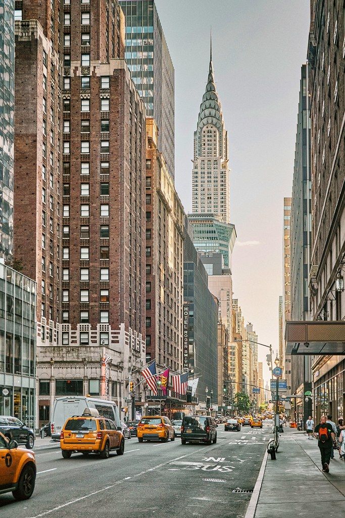 a city street filled with lots of tall buildings