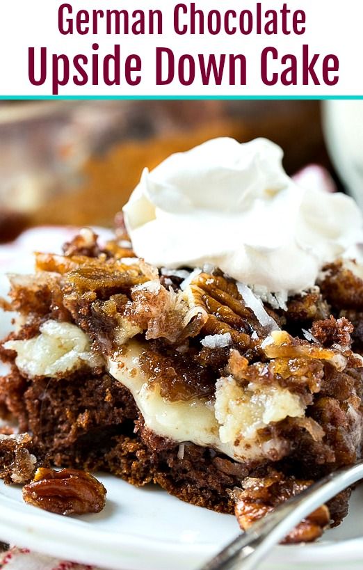 german chocolate upside down cake on a plate with whipped cream and pecans in the background