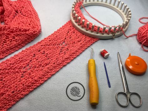 some knitting supplies are laying out on a table