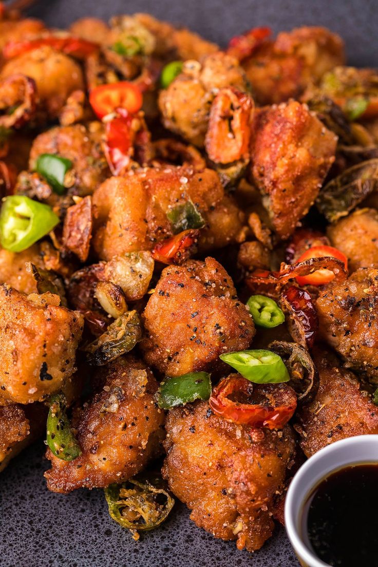 fried food on a plate with dipping sauce