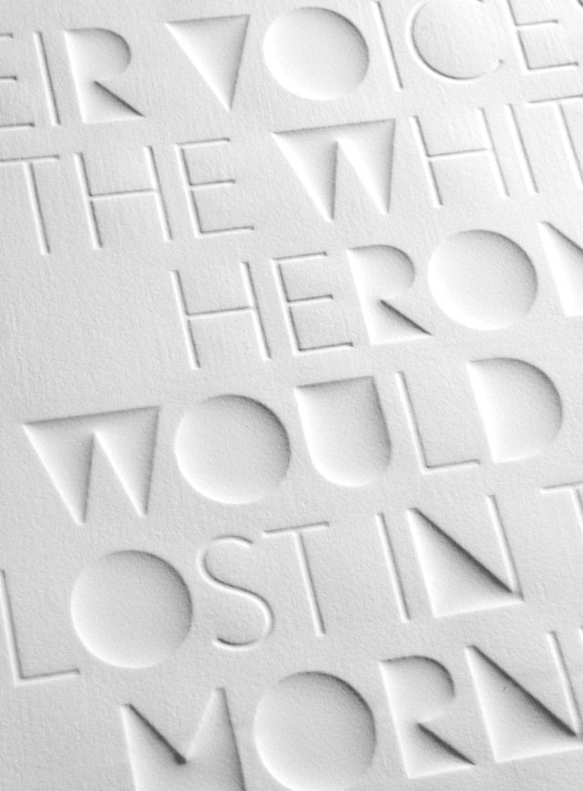 the words are made up of white paper